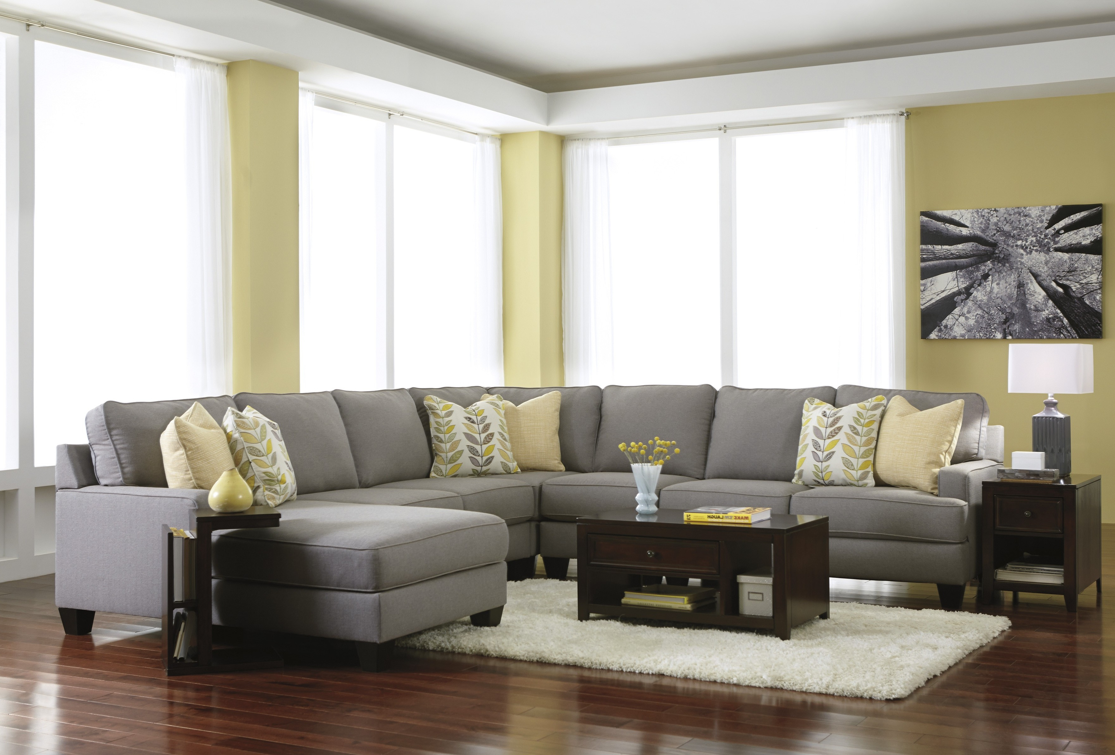 modern living room ideas decorating with grey fabric sectionals sofa and black wooden coffee table