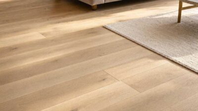 Premium wide-plank engineered hardwood flooring installed in a sunlit modern home